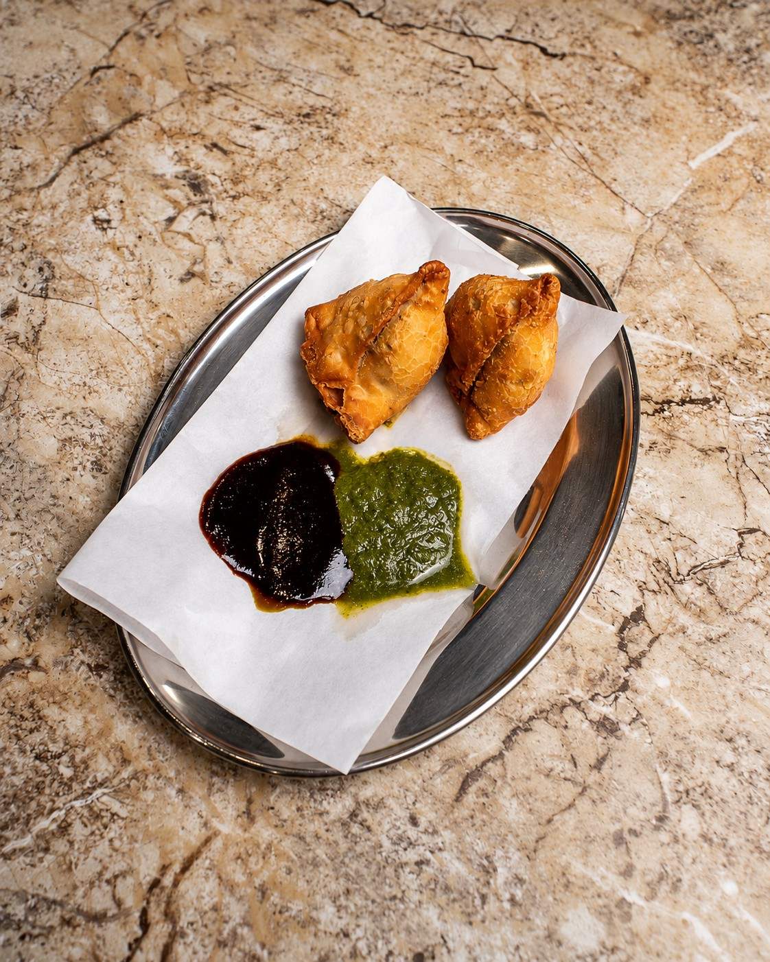 Crisp samosas with mint and tamarind chutney